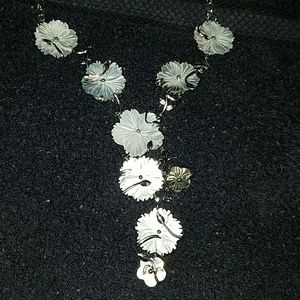 Sterling silver flower and leaf Y necklace.